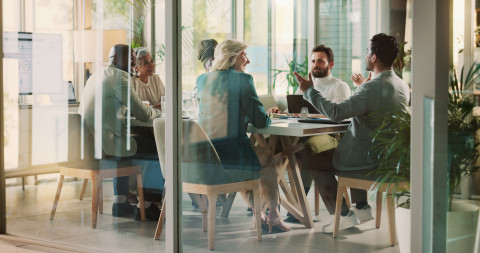 office room with business people in a meeting